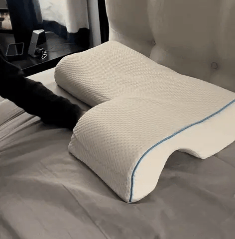 Man resting on the same sculpted arm-channel couple pillow